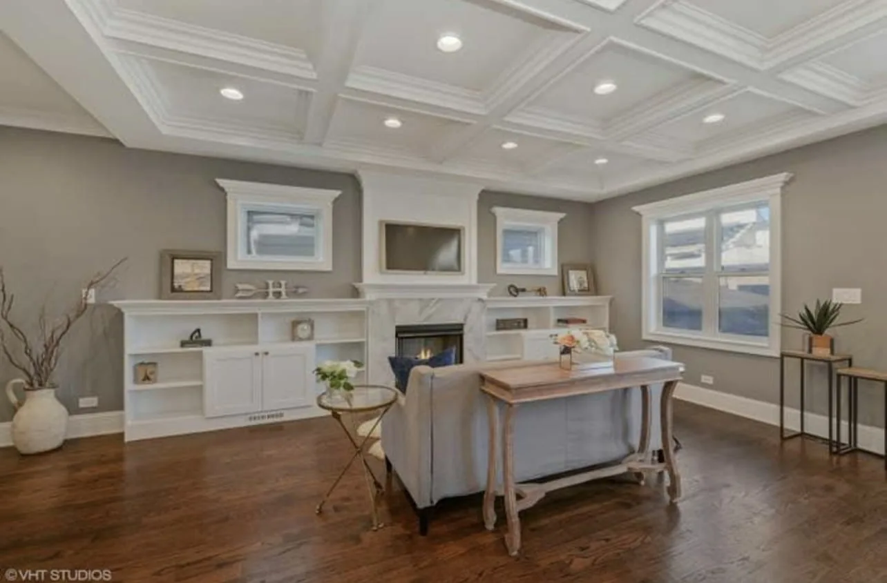 Finished living space with built-in cabinetry and architectural ceiling detail